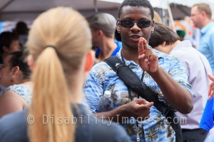 Deaf participant signing at ADA Day
