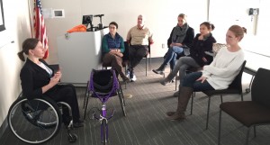 Staff listening to former paralympian Cheri Blauwet