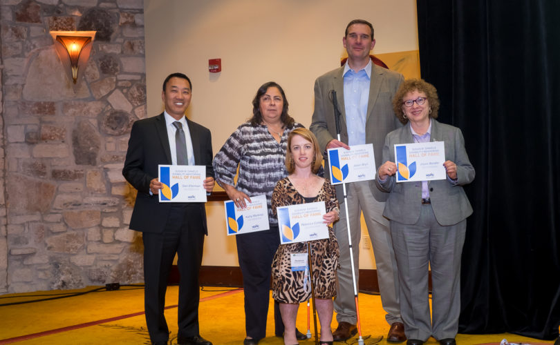 Five inductees to the Disability Mentoring Hall of Fame standing together with their certificates