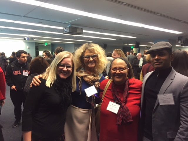 PYD staff and board member smiling alongside other SIF-selected members