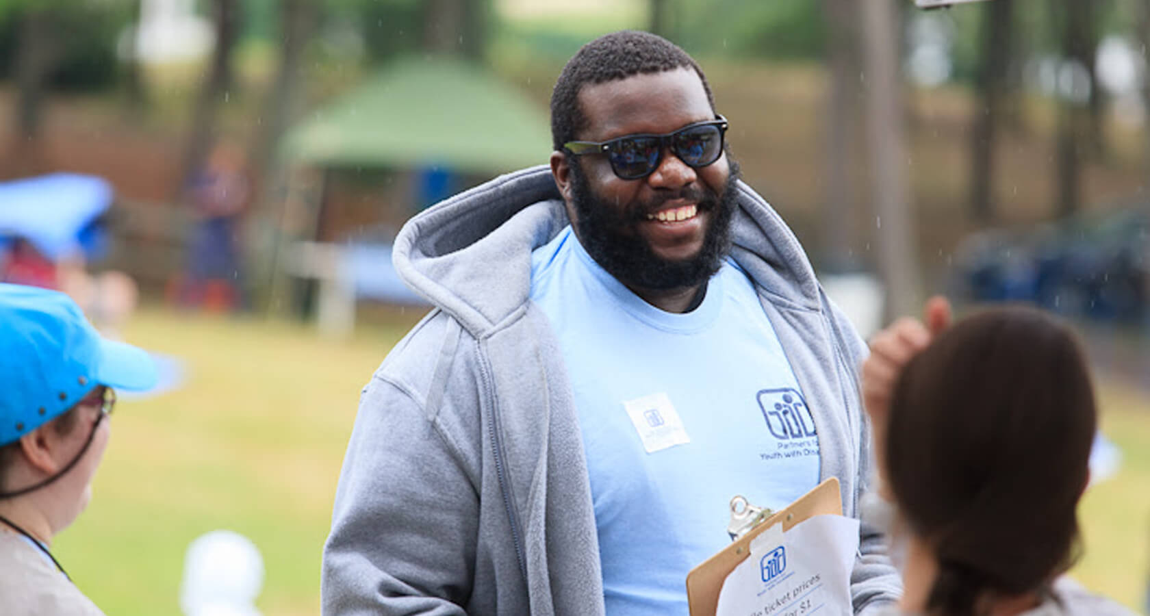 An energetic volunteer working at a PYD event