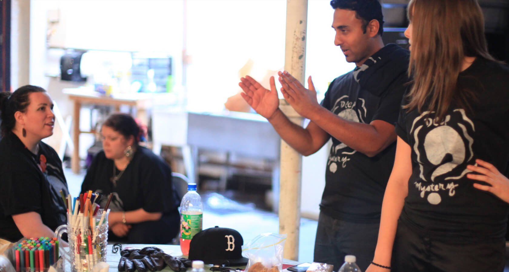 A PYD staff member meeting with colleagues