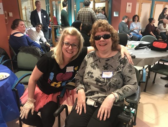 Genelle and Moe pose for a photo together at MAN.