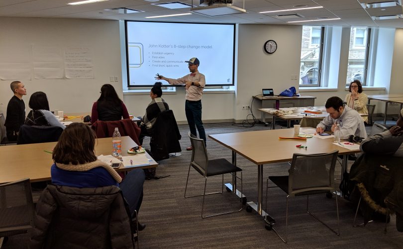 Steve presenting in front of the BICYP cohort in a conference room set-up