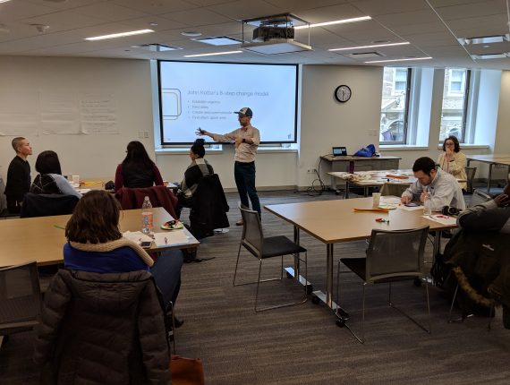Steve presenting John Kotter's 8 step change model at a Boston Inclusion Community presentation in 2018
