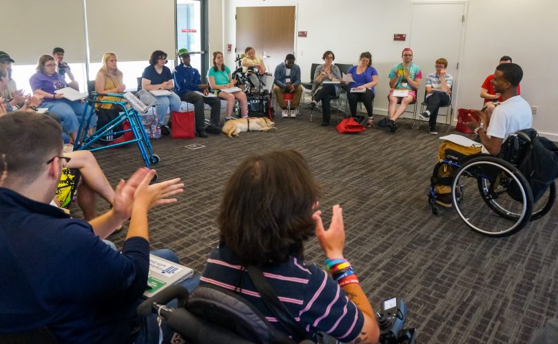 Many YLF participants gathered in a circle
