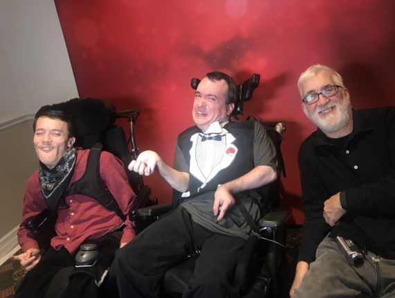 Austin, Gregory, and George smile for a photo at Gregory's 40th birthday party