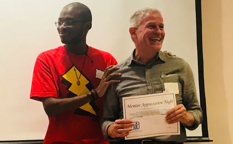 PYD mentor receiving award on Mentor Appreciation Night