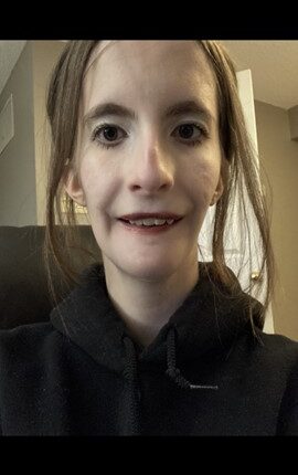 A photo of Jillian Howland, a caucasian young woman with shoulder length dark brown hair