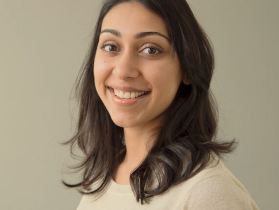 photo of Lynn Pais, a caucasian young woman with shoulder length brown hair who is smiling