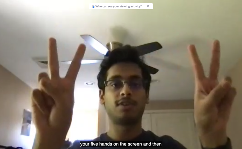 Participant doing peace signs