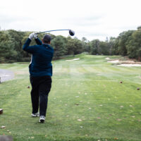 Man swinging a golf club
